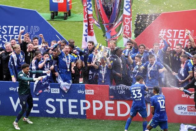 AFC Wimbledon lift the Sky Bet League Two Play-Off Final trophy AFC Wimbledon v Walsall, EFL Sky Bet League Two, Play-Off Final, Football, Wembley Stadium, London, UK - 26 May 2025 EDITORIAL USE ONLY No use with unauthorised audio, video, data, fixture lists, club league logos or live services. Online in-match use limited to 120 images, no video emulation. No use in betting, games or single club league player publications. Copyright: xIanxTuttle Shutterstockx 15316456dk