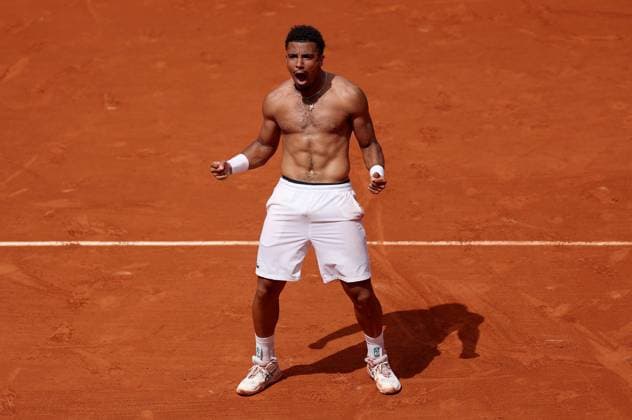 Arthur Fils of France celebrates ripping off his shirt following his win French Open Tennis, Day Five, Tennis, Roland Garros, Paris, France - 29 May 2025 EDITORIAL USE ONLY No use with unauthorised audio, video, data, fixture lists, club league logos or live services. Online in-match use limited to 120 images, no video emulation. No use in betting, games or single club league player publications. Copyright: xEllaxLing Shutterstockx 15328391al