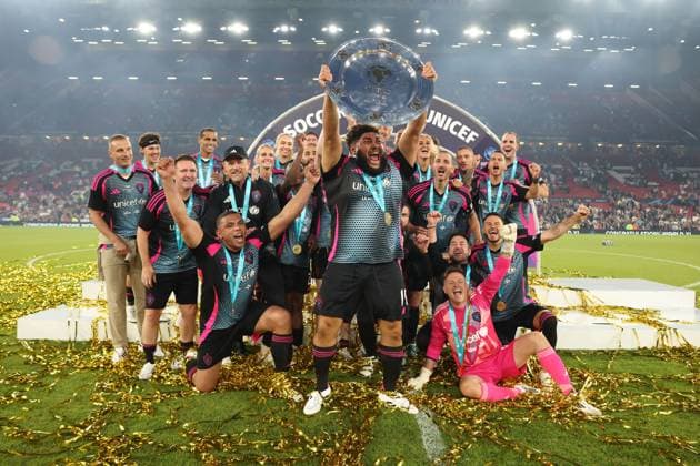 Big Zuu of World Eleven celebrates with team mates with the winners trophy England XI v World XI, Soccer Aid for Unicef 2025, Football, Old Trafford, Manchester, UK - 15 Jun 2025 EDITORIAL USE ONLY No use with unauthorised audio, video, data, fixture lists, club league logos or live services. Online in-match use limited to 120 images, no video emulation. No use in betting, games or single club league player publications. Copyright: xRyanxBrowne Shutterstockx 15352333ef