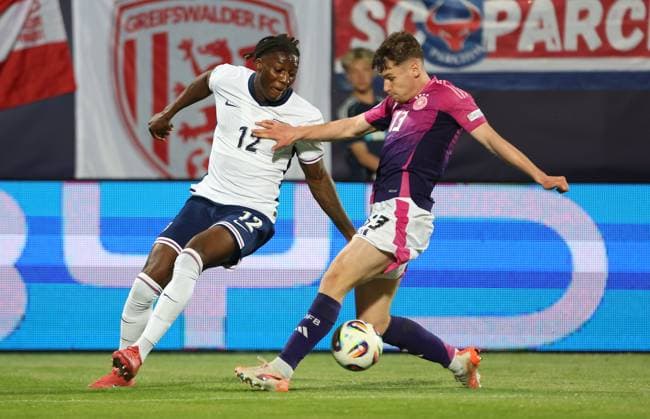 Brooke Norton-Cuffy of England Under 21 and Lukas Ullrich of Germany Under 21 in action England U21, U 21 v Germany U21, UEFA Under 21 European Championship, EM, Europameisterschaft 2025, Group B, Football, Nitra Stadium, Nitra, Slovakia - 18 Jun 2025 EDITORIAL USE ONLY No use with unauthorised audio, video, data, fixture lists, club league logos or live services. Online in-match use limited to 120 images, no video emulation. No use in betting, games or single club league player publications. Copyright: xNikolaxKrstic Shutterstockx 15363358cy