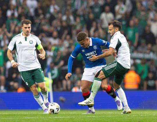Max Aarons of Rangers in action with Pedro Chirivella of Panathinaikos during UEFA Champions League second qualifying round first leg at Ibrox Stadium, Glasgow. Rangers v Panathinaikos, UEFA Champions League, 2nd Qualifying Round, Football, Ibrox Stadium, Glasgow, UK - 22 Jul 2025Glasgow Ibrox Stadium United Kingdom EDITORIAL USE ONLY No use with unauthorised audio, video, data, fixture lists, club league logos or live services. Online in-match use limited to 120 images, no video emulation. No use in betting, games or single club league player publications. Copyright: xRangersxFC Shutterstockx 15409270bu