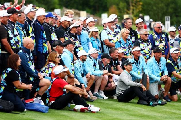 Joaquin Niemann of Chile celebrates winning the tournament with volunteers. LIV Golf UK, Day Three, Golf, JCB Golf & Country Club, Uttoxeter, UK - 27 Jul 2025Uttoxeter JCB Golf & Country Club United Kingdom EDITORIAL USE ONLY No use with unauthorised audio, video, data, fixture lists, club league logos or live services. Online in-match use limited to 120 images, no video emulation. No use in betting, games or single club league player publications. Copyright: xJamesxMarsh Shutterstockx 15410873cn