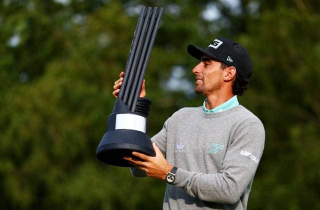 Joaquin Niemann of Chile celebrates winning the tournament with the trophy. LIV Golf UK, Day Three, Golf, JCB Golf & Country Club, Uttoxeter, UK - 27 Jul 2025Uttoxeter JCB Golf & Country Club United Kingdom EDITORIAL USE ONLY No use with unauthorised audio, video, data, fixture lists, club league logos or live services. Online in-match use limited to 120 images, no video emulation. No use in betting, games or single club league player publications. Copyright: xJamesxMarsh Shutterstockx 15410873co