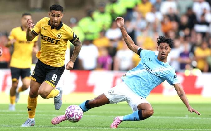 Joao Gomes of Wolverhampton Wanderers and Tijjani Reijnders of Manchester City in action Wolverhampton Wanderers v Manchester City, Premier League, Football, Molineux, Wolverhampton, UK - 16 Aug 2025Wolverhampton Molineux United Kingdom EDITORIAL USE ONLY No use with unauthorised audio, video, data, fixture lists, club league logos or live services. Online in-match use limited to 120 images, no video emulation. No use in betting, games or single club league player publications. Copyright: xKieranxMcManus Shutterstockx 15444080ae