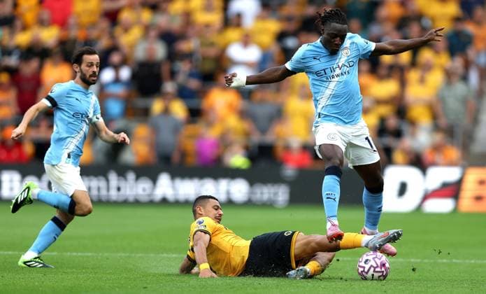 Andrà of Wolverhampton Wanderers tackles Jà rà my Doku of Manchester City Wolverhampton Wanderers v Manchester City, Premier League, Football, Molineux, Wolverhampton, UK - 16 Aug 2025Wolverhampton Molineux United Kingdom EDITORIAL USE ONLY No use with unauthorised audio, video, data, fixture lists, club league logos or live services. Online in-match use limited to 120 images, no video emulation. No use in betting, games or single club league player publications. Copyright: xKieranxMcManus Shutterstockx 15444080al