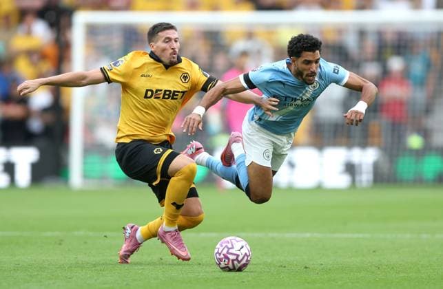 Matt Doherty of Wolverhampton Wanderers fouls Omar Marmoush of Manchester City Wolverhampton Wanderers v Manchester City, Premier League, Football, Molineux, Wolverhampton, UK - 16 Aug 2025Wolverhampton Molineux United Kingdom EDITORIAL USE ONLY No use with unauthorised audio, video, data, fixture lists, club league logos or live services. Online in-match use limited to 120 images, no video emulation. No use in betting, games or single club league player publications. Copyright: xKieranxMcManus Shutterstockx 15444080bg