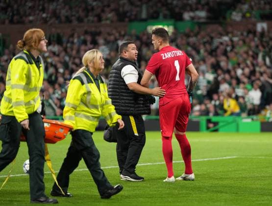 Injured Kairat Almaty goalkeeper Alexandr Zarutskiy limps off the pitch after rejecting a stretcher. Celtic v Kairat Almaty, UEFA Champions League, Play-Off Round, First Leg, Football, Celtic Park, Glasgow, Scotland, UK - 20 Aug 2025Glasgow Celtic Park Scotland United Kingdom EDITORIAL USE ONLY No use with unauthorised audio, video, data, fixture lists, club league logos or live services. Online in-match use limited to 120 images, no video emulation. No use in betting, games or single club league player publications. Copyright: xStuartxWallace Shutterstockx 15446684az