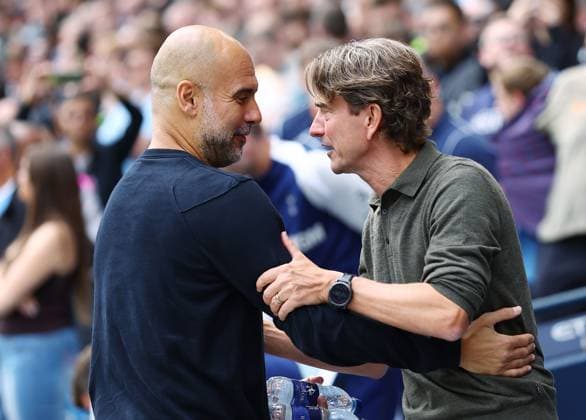 Manchester City manager Pep Guardiola with counterpart Thomas Frank of Tottenham Hotspur ahead of the match Manchester City v Tottenham Hotspur, Premier League, Football, Etihad Stadium, Manchester, UK - 23 Aug 2025Manchester Etihad Stadium United Kingdom EDITORIAL USE ONLY No use with unauthorised audio, video, data, fixture lists, club league logos or live services. Online in-match use limited to 120 images, no video emulation. No use in betting, games or single club league player publications. Copyright: xMattxWest Shutterstockx 15449559bc