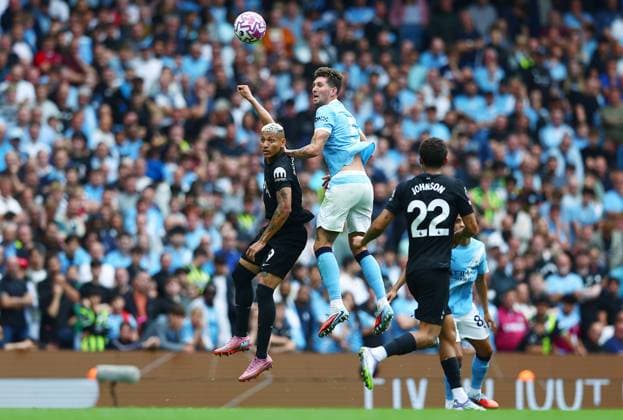 John Stones of Manchester City and Richarlison of Tottenham Hotspur Manchester City v Tottenham Hotspur, Premier League, Football, Etihad Stadium, Manchester, UK - 23 Aug 2025Manchester Etihad Stadium United Kingdom EDITORIAL USE ONLY No use with unauthorised audio, video, data, fixture lists, club league logos or live services. Online in-match use limited to 120 images, no video emulation. No use in betting, games or single club league player publications. Copyright: xMattxWest Shutterstockx 15449559dk
