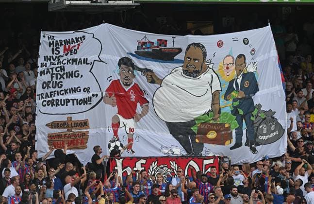 Crystal Palace fans hold aloft a banner referring to Evangelos Marinakis ,owner of Nottingham Forest Crystal Palace v Nottingham Forest, Premier League, Football, Selhurst Park, London, UK - 24 Aug 2025London Selhurst Park United Kingdom EDITORIAL USE ONLY No use with unauthorised audio, video, data, fixture lists, club league logos or live services. Online in-match use limited to 120 images, no video emulation. No use in betting, games or single club league player publications. Copyright: xAlanxWalter Shutterstockx 15451858af