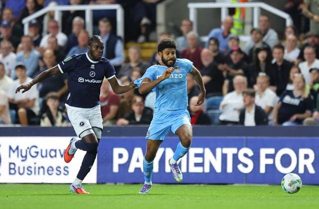 Ellis Simms of Coventry City is fouled by Kamarl Grant of Millwall Millwall v Coventry City, EFL Carabao Cup, Second Round, Football, The Den, London, UK - 26 Aug 2025London The Den United Kingdom EDITORIAL USE ONLY No use with unauthorised audio, video, data, fixture lists, club league logos or live services. Online in-match use limited to 120 images, no video emulation. No use in betting, games or single club league player publications. Copyright: xMichaelxZemanek Shutterstockx 15455833da