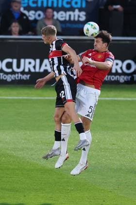 Harry Maguire of Manchester United, ManU and Cameron Gardner of Grimsby Town Grimsby Town v Manchester United, EFL Carabao Cup, Second Round, Football, Blundell Park, Grimsby, UK - 27 Aug 2025Grimsby Blundell Park United Kingdom EDITORIAL USE ONLY No use with unauthorised audio, video, data, fixture lists, club league logos or live services. Online in-match use limited to 120 images, no video emulation. No use in betting, games or single club league player publications. Copyright: xPaulxCurrie Shutterstockx 15457582am