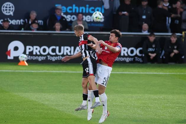 Harry Maguire of Manchester United, ManU and Cameron Gardner of Grimsby Town Grimsby Town v Manchester United, EFL Carabao Cup, Second Round, Football, Blundell Park, Grimsby, UK - 27 Aug 2025Grimsby Blundell Park United Kingdom EDITORIAL USE ONLY No use with unauthorised audio, video, data, fixture lists, club league logos or live services. Online in-match use limited to 120 images, no video emulation. No use in betting, games or single club league player publications. Copyright: xPaulxCurrie Shutterstockx 15457582an