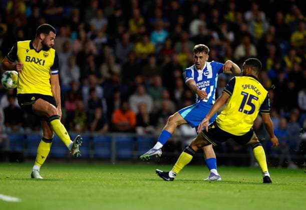 Brajan Gruda shoots to score the 2nd Brighton and Hove Albion goal as and Elliott Moore (left) Brodie Spencer (15) of Oxford United challenge Oxford United v Brighton and Hove Albion, EFL Carabao Cup, Second Round, Football, Kassam Stadium, Oxford, UK - 27 Aug 2025Oxford Kassam Stadium United Kingdom EDITORIAL USE ONLY No use with unauthorised audio, video, data, fixture lists, club league logos or live services. Online in-match use limited to 120 images, no video emulation. No use in betting, games or single club league player publications. Copyright: xMattxImpey Shutterstockx 15457586at