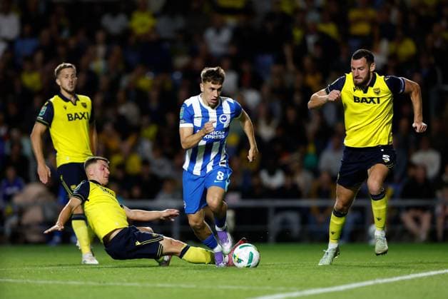 Brajan Gruda of Brighton and Hove Albion gets past of Cameron Brannagan (8) and Elliott Moore (5) of Oxford United Oxford United v Brighton and Hove Albion, EFL Carabao Cup, Second Round, Football, Kassam Stadium, Oxford, UK - 27 Aug 2025Oxford Kassam Stadium United Kingdom EDITORIAL USE ONLY No use with unauthorised audio, video, data, fixture lists, club league logos or live services. Online in-match use limited to 120 images, no video emulation. No use in betting, games or single club league player publications. Copyright: xMattxImpey Shutterstockx 15457586bm