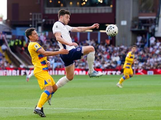 Birmingham, England, 6th September 2025. Declan Rice of England leaps up to control the ball during the England vs Andorra FIFA World Cup, WM, Weltmeisterschaft, Fussball Qualifier match at Villa Park, Birmingham. Picture credit should read: Andrew Yates Sportimage EDITORIAL USE ONLY. No use with unauthorised audio, video, data, fixture lists, club league logos or live services. Online in-match use limited to 120 images, no video emulation. No use in betting, games or single club league player publications. SPI_020_AY_ENG_AND SPI-4113-0021