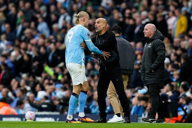 Manchester, England, 14th September 2025. Erling Haland of Manchester City and Pep Guardiola manager of Manchester City in conversation during the Manchester City vs Manchester United, ManU Premier League match at the Etihad Stadium, Manchester. Picture credit should read: Andrew Yates Sportimage EDITORIAL USE ONLY. No use with unauthorised audio, video, data, fixture lists, club league logos or live services. Online in-match use limited to 120 images, no video emulation. No use in betting, games or single club league player publications. SPI_040_AY_MCI_MUFC SPI-4139-0040