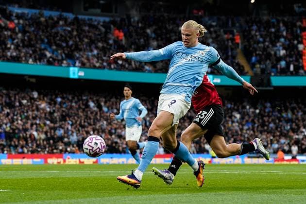 Manchester, England, 14th September 2025. Erling Haland of Manchester City scores a goal to make it 2-0 during the Manchester City vs Manchester United, ManU Premier League match at the Etihad Stadium, Manchester. Picture credit should read: Andrew Yates Sportimage EDITORIAL USE ONLY. No use with unauthorised audio, video, data, fixture lists, club league logos or live services. Online in-match use limited to 120 images, no video emulation. No use in betting, games or single club league player publications. SPI_043_AY_MCI_MUFC SPI-4139-0043