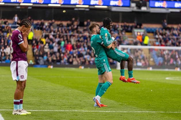 (250915) -- BURNLEY, Sept. 15, 2025 -- Liverpool s Conor Bradley (C) and Jeremie Frimpong (R) celebrate after giving away a penalty during the English Premier League match between Burnley FC and Liverpool FC in Burnley, Britain, on Sept. 14, 2025. FOR EDITORIAL USE ONLY. NOT FOR SALE FOR MARKETING OR ADVERTISING CAMPAIGNS. NO USE WITH UNAUTHORIZED AUDIO, VIDEO, DATA, FIXTURE LISTS, CLUB LEAGUE LOGOS OR LIVE SERVICES. ONLINE IN-MATCH USE LIMITED TO 45 IMAGES, NO VIDEO EMULATION. NO USE IN BETTING, GAMES OR SINGLE CLUB LEAGUE PLAYER PUBLICATIONS. (SP)BRITAIN-BURNLEY-FOOTBALL-PREMIER LEAGUE-BURNLEY VS LIVERPOOL LixYing