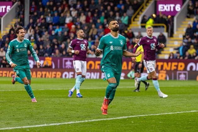 (250915) -- BURNLEY, Sept. 15, 2025 -- Liverpool s Mohamed Salah (front) celebrates after scoring a penalty goal during the English Premier League match between Burnley FC and Liverpool FC in Burnley, Britain, on Sept. 14, 2025. FOR EDITORIAL USE ONLY. NOT FOR SALE FOR MARKETING OR ADVERTISING CAMPAIGNS. NO USE WITH UNAUTHORIZED AUDIO, VIDEO, DATA, FIXTURE LISTS, CLUB LEAGUE LOGOS OR LIVE SERVICES. ONLINE IN-MATCH USE LIMITED TO 45 IMAGES, NO VIDEO EMULATION. NO USE IN BETTING, GAMES OR SINGLE CLUB LEAGUE PLAYER PUBLICATIONS. (SP)BRITAIN-BURNLEY-FOOTBALL-PREMIER LEAGUE-BURNLEY VS LIVERPOOL LixYing