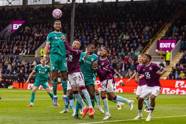 (250915) -- BURNLEY, Sept. 15, 2025 -- Liverpool s Cody Gakpo (top) wins a header during the English Premier League match between Burnley FC and Liverpool FC in Burnley, Britain, on Sept. 14, 2025. FOR EDITORIAL USE ONLY. NOT FOR SALE FOR MARKETING OR ADVERTISING CAMPAIGNS. NO USE WITH UNAUTHORIZED AUDIO, VIDEO, DATA, FIXTURE LISTS, CLUB LEAGUE LOGOS OR LIVE SERVICES. ONLINE IN-MATCH USE LIMITED TO 45 IMAGES, NO VIDEO EMULATION. NO USE IN BETTING, GAMES OR SINGLE CLUB LEAGUE PLAYER PUBLICATIONS. (SP)BRITAIN-BURNLEY-FOOTBALL-PREMIER LEAGUE-BURNLEY VS LIVERPOOL LixYing
