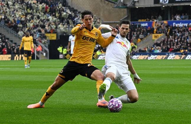 Fer Lopez of Wolverhampton Wanderers and Anton Stach of Leeds United Wolverhampton Wanderers v Leeds United, Premier League, Football, Molineux, Wolverhampton, UK - 20 Sep 2025Wolverhampton Molineux United Kingdom EDITORIAL USE ONLY No use with unauthorised audio, video, data, fixture lists, club league logos or live services. Online in-match use limited to 120 images, no video emulation. No use in betting, games or single club league player publications. Copyright: xAnnaxGowthorpe Shutterstockx 15487097al