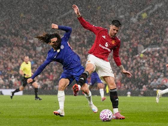 Manchester, England, 20th September 2025. Benjamin Sesko of Manchester United, ManU (R) is challenged by Marc Cucurella of Chelsea during the Manchester United vs Chelsea Premier League match at Old Trafford, Manchester. Picture credit should read: Andrew Yates Sportimage EDITORIAL USE ONLY. No use with unauthorised audio, video, data, fixture lists, club league logos or live services. Online in-match use limited to 120 images, no video emulation. No use in betting, games or single club league player publications. SPI_024_AY_MAN_UTD_CHELSEA SPI-4149-0024