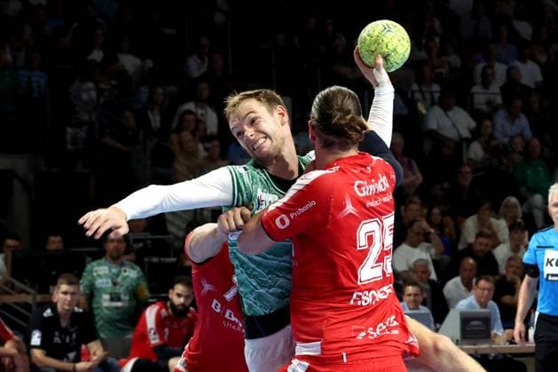 DEU, DHB, 1.HBL, Fuechse Berlin vs. Melsungen, 21.09.2025, Max-Schmeling-Halle, Berlin, DEU, DHB, 1.HBL, Fuechse Berlin vs. Melsungen, im Bild Mathias Gidsel (Fuechse Berlin 19), Olle Forsell Schefvert (MT Melsungen 25)