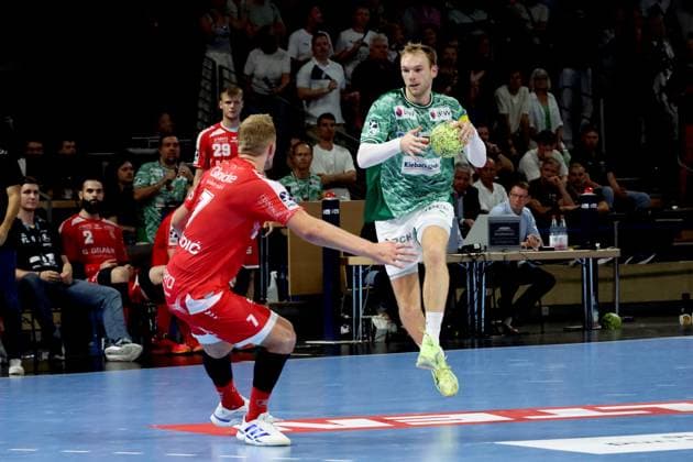 DEU, DHB, 1.HBL, Fuechse Berlin vs. Melsungen, 21.09.2025, Max-Schmeling-Halle, Berlin, DEU, DHB, 1.HBL, Fuechse Berlin vs. Melsungen, im Bild Mathias Gidsel (Fuechse Berlin 19), David Mandic (MT Melsungen 7)