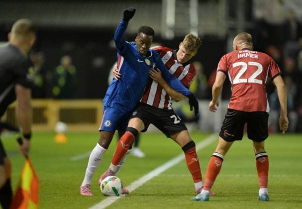 Jamie Gittens of Chelsea and Ivan Varfolomeyev of Lincoln City Lincoln City v Chelsea, EFL Carabao Cup, Third Round, Football, LNER Stadium, Lincoln, UK - 23 Sep 2025Lincoln LNER Stadium United Kingdom EDITORIAL USE ONLY No use with unauthorised audio, video, data, fixture lists, club league logos or live services. Online in-match use limited to 120 images, no video emulation. No use in betting, games or single club league player publications. Copyright: xGreigxCowie Shutterstockx 15498456z