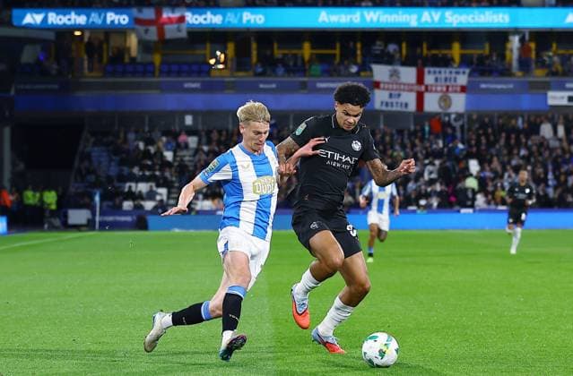 Nico O Reilly of Manchester City and Lasse Sorensen of Huddersfield Town Huddersfield Town v Manchester City, EFL Carabao Cup, Third Round, Football, Accu Stadium, Huddersfield, UK - 24 Sep 2025Huddersfield Accu Stadium United Kingdom EDITORIAL USE ONLY No use with unauthorised audio, video, data, fixture lists, club league logos or live services. Online in-match use limited to 120 images, no video emulation. No use in betting, games or single club league player publications. Copyright: xMattxWest Shutterstockx 15498595y
