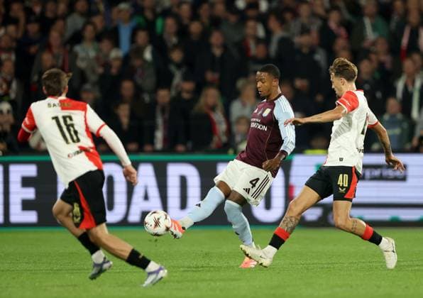 Ezri Konsa of Aston Villa in action against Luciano Valente of Feyenoord Feyenoord v Aston Villa, UEFA Europa League, Group Stage, Football, De Kuip, Rotterdam, Netherlands - 02 Oct 2025Rotterdam De Kuip Netherlands EDITORIAL USE ONLY No use with unauthorised audio, video, data, fixture lists, club league logos or live services. Online in-match use limited to 120 images, no video emulation. No use in betting, games or single club league player publications. Copyright: xBartxStoutjesdijk Shutterstockx 15504059ak