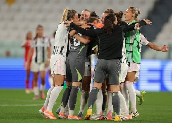 Turin, Italy, 7th October 2025. Cecilia Salvai of Juventus is mobbed by team mates following the final whistle, as her brace gave the hosts a 2-1 victory in the Juventus Women vs SL Benfica Women UEFA Womens Champions League match at Juventus Stadium, Turin. Picture credit should read: Jonathan Moscrop Sportimage EDITORIAL USE ONLY. No use with unauthorised audio, video, data, fixture lists, club league logos or live services. Online in-match use limited to 120 images, no video emulation. No use in betting, games or single club league player publications. SPI_057_JM_JUVE_BENFICA_UWCL SPI-4189-0057