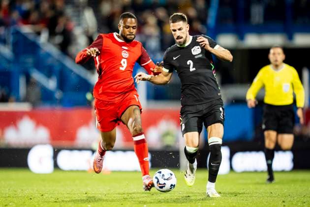 October 10, 2025, Montreal, Pq, CANADA: Australia s Milos Degenek (2) defends against Canada s Cyle Larin (9) during first half International Friendly, Länderspiel, Nationalmannschaft soccer action in Montreal, on Friday, October 10, 2025. Canada News - October 10, 2025 - ZUMAc35_ 20251010_zaf_c35_085 Copyright: xChristopherxKatsarovx