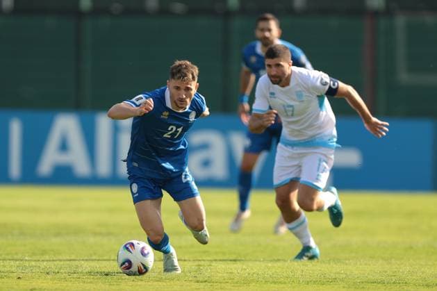 Serravalle, Italy, 12th October 2025. Marinos Tzionis of Cyprus is pursued by Alessandro Golinucci of San Marino during the San Marino vs Cyprus FIFA World Cup, WM, Weltmeisterschaft, Fussball European Qualifying match at San Marino Stadium, Serravalle. Picture credit should read: Jonathan Moscrop Sportimage EDITORIAL USE ONLY. No use with unauthorised audio, video, data, fixture lists, club league logos or live services. Online in-match use limited to 120 images, no video emulation. No use in betting, games or single club league player publications. SPI_004_JM_SANMARINO_CYPRUS_EQ SPI-4191-0004