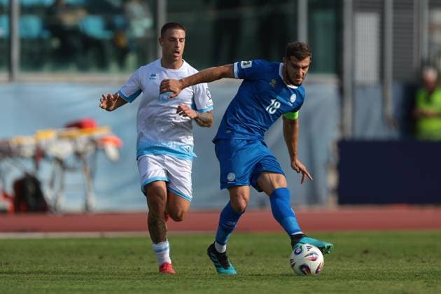 Serravalle, Italy, 12th October 2025. Kostakis Artymatas of Cyprus is pursued by Samuele Zannoni of San Marino during the San Marino vs Cyprus FIFA World Cup, WM, Weltmeisterschaft, Fussball European Qualifying match at San Marino Stadium, Serravalle. Picture credit should read: Jonathan Moscrop Sportimage EDITORIAL USE ONLY. No use with unauthorised audio, video, data, fixture lists, club league logos or live services. Online in-match use limited to 120 images, no video emulation. No use in betting, games or single club league player publications. SPI_028_JM_SANMARINO_CYPRUS_EQ SPI-4191-0028