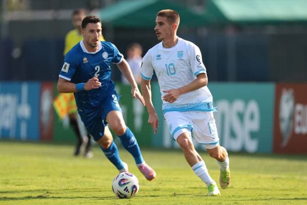 Serravalle, Italy, 12th October 2025. Filippo Berardi of San Marino is pursued by Kostas Pileas of Cyprus during the San Marino vs Cyprus FIFA World Cup, WM, Weltmeisterschaft, Fussball European Qualifying match at San Marino Stadium, Serravalle. Picture credit should read: Jonathan Moscrop Sportimage EDITORIAL USE ONLY. No use with unauthorised audio, video, data, fixture lists, club league logos or live services. Online in-match use limited to 120 images, no video emulation. No use in betting, games or single club league player publications. SPI_036_JM_SANMARINO_CYPRUS_EQ SPI-4191-0036