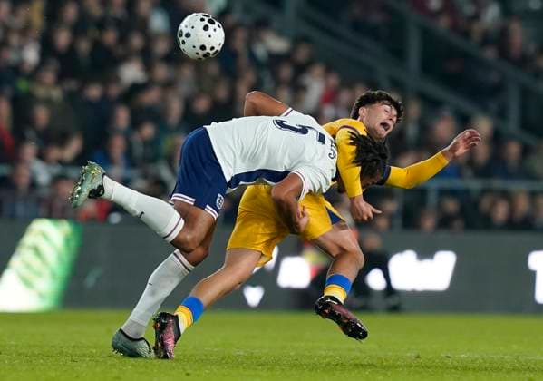Derby, England, 13th October 2025. Ashley Phillips of England (L) is challenged by Miquel Torres of Andorra during the England U21, U 21 vs Andorra U21 UEFA European Under-21 Championship Qualifier match at Pride Park Stadium, Derby. Picture credit should read: Andrew Yates Sportimage EDITORIAL USE ONLY. No use with unauthorised audio, video, data, fixture lists, club league logos or live services. Online in-match use limited to 120 images, no video emulation. No use in betting, games or single club league player publications. SPI_008_AY_ENGu21_ANDORRAu21 SPI-4215-0008