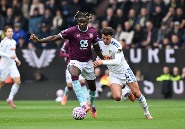 Lesley Ugochukwu of Burnley and Ethan Ampadu of Leeds United Burnley v Leeds United, Premier League, Football, Turf Moor, Burnley, UK - 18 Oct 2025Leeds Turf Moor United Kingdom EDITORIAL USE ONLY No use with unauthorised audio, video, data, fixture lists, club league logos or live services. Online in-match use limited to 120 images, no video emulation. No use in betting, games or single club league player publications. Copyright: xAnnaxGowthorpe Shutterstockx 15544973v