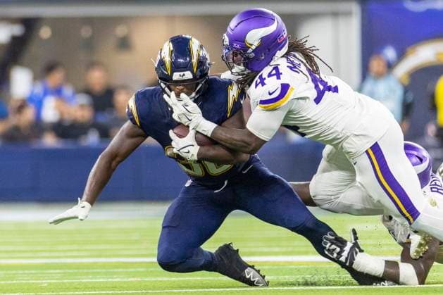 October 23, 2025, Los Angeles, California, USA: Los Angeles Chargers running back Kimani Vidal 30 is brought down by Minnesota Vikings safety Joshua Metellus 44 during an NFL, American Football Herren, USA football game at SoFi Stadium, Thursday Oct. 23, 2025, in Inglewood, Calif. Los Angeles USA - ZUMAc68_ 20251023_zaf_c68_027 Copyright: xRingoxChiux