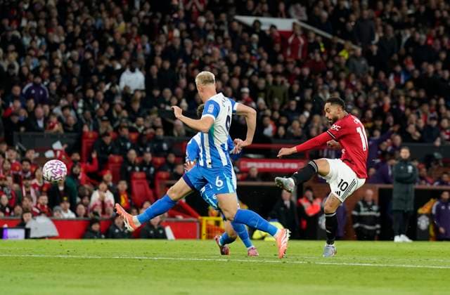 Manchester, England, 25th October 2025. Matheus Cunha of Manchester United, ManU (r) has a shot which is saved during the Manchester United vs Brighton and Hove Albion Premier League match at Old Trafford, Manchester. Picture credit should read: Andrew Yates Sportimage EDITORIAL USE ONLY. No use with unauthorised audio, video, data, fixture lists, club league logos or live services. Online in-match use limited to 120 images, no video emulation. No use in betting, games or single club league player publications. SPI_021_AY_Man_Utd_Brighton SPI-4237-0020