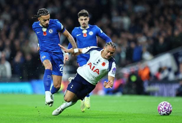 Xavi Simons of Tottenham Hotspur is fouled by Malo Gusto of Chelsea Tottenham Hotspur v Chelsea, Premier League, Football, Tottenham Hotspur Stadium, London, UK - 01 Nov 2025London Tottenham Hotspur Stadium United Kingdom EDITORIAL USE ONLY No use with unauthorised audio, video, data, fixture lists, club league logos or live services. Online in-match use limited to 120 images, no video emulation. No use in betting, games or single club league player publications. Copyright: xMichaelxZemanek Shutterstockx 15639958f