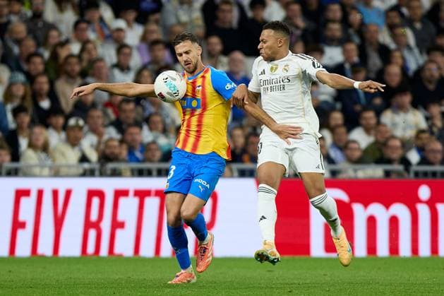 Kylian Mbappe of Real Madrid CF and Jose Copete of Valencia CF Real Madrid v Valencia, La Liga, Football, Estadio Santiago Bernabeu, Madrid, Spain - 01 Nov 2025Madrid Estadio Santiago Bernabu Spain EDITORIAL USE ONLY No use with unauthorised audio, video, data, fixture lists, club league logos or live services. Online in-match use limited to 120 images, no video emulation. No use in betting, games or single club league player publications. Copyright: xRubenxAlbarran Shutterstockx 15649992dm