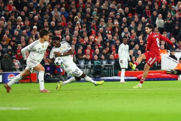Aurà lien Tchouamà ni of Real Madrid handles from a shot from Dominik Szoboszlai of Liverpool Liverpool v Real Madrid, UEFA Champions League, Group Stage, Football, Anfield, Liverpool, UK - 04 Nov 2025Liverpool Anfield United Kingdom EDITORIAL USE ONLY No use with unauthorised audio, video, data, fixture lists, club league logos or live services. Online in-match use limited to 120 images, no video emulation. No use in betting, games or single club league player publications. Copyright: xPaulxCurrie Shutterstockx 15642053bj