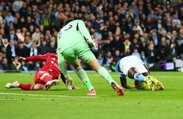 Giorgi Mamardashvili of Liverpool fouls Jeremy Doku of Manchester City for a penalty Manchester City v Liverpool, Premier League, Football, Etihad Stadium, Manchester, UK - 09 Nov 2025Manchester Etihad Stadium United Kingdom EDITORIAL USE ONLY No use with unauthorised audio, video, data, fixture lists, club league logos or live services. Online in-match use limited to 120 images, no video emulation. No use in betting, games or single club league player publications. Copyright: xPaulxCurrie Shutterstockx 15702266x