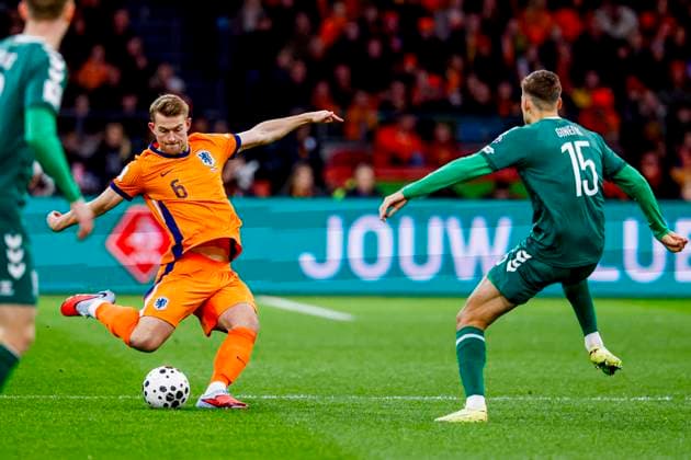 Matthijs De Ligt of the Netherlands passes the ball under pressure from Gvidas Gineitis of Lithuania Netherlands v Lithuania, FIFA World Cup, WM, Weltmeisterschaft, Fussball 2026 Qualifier, Netherlands v Lithuania, Johan Cruijff Arena, November 17, 2025, Amsterdam, Netherlands.