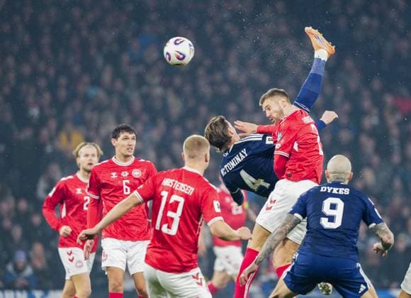 Scott McTominay of Scotland scores with an overhead kick, under pressure fromJoachim Andersen of Denmark, to give Scotland a 1-0 lead. Scotland v Denmark, FIFA 2026 World Cup Qualifying, Group C, Football, Hampden Park, Glasgow, Scotland, UK - 18 Nov 2025Glasgow Hampden Park United Kingdom EDITORIAL USE ONLY No use with unauthorised audio, video, data, fixture lists, club league logos or live services. Online in-match use limited to 120 images, no video emulation. No use in betting, games or single club league player publications. Copyright: xStuartxWallace Shutterstockx 15846619d
