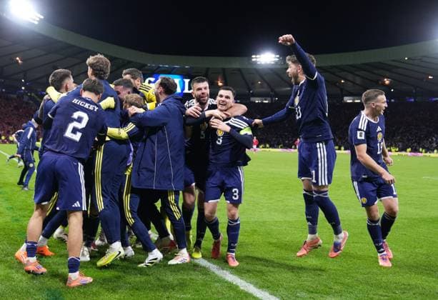 Kenny McLean of Scotland is mobbed by team mates after he scored from inside his own half to give Scotland a 4-2 lead. Scotland v Denmark, FIFA 2026 World Cup Qualifying, Group C, Football, Hampden Park, Glasgow, Scotland, UK - 18 Nov 2025Glasgow Hampden Park United Kingdom EDITORIAL USE ONLY No use with unauthorised audio, video, data, fixture lists, club league logos or live services. Online in-match use limited to 120 images, no video emulation. No use in betting, games or single club league player publications. Copyright: xStuartxWallace Shutterstockx 15846619bj