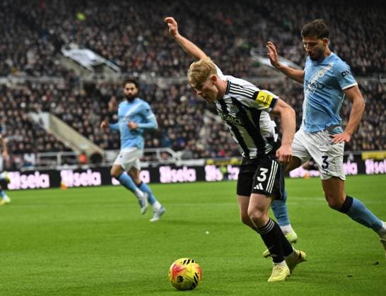Lewis Hall of Newcastle United goes down after a challenge from Ruben Dias of Manchester City Newcastle United v Manchester City, Premier League, Football, St James Park, Newcastle, UK - 22 Nov 2025Newcastle St James Park United Kingdom EDITORIAL USE ONLY No use with unauthorised audio, video, data, fixture lists, club league logos or live services. Online in-match use limited to 120 images, no video emulation. No use in betting, games or single club league player publications. Copyright: xRichardxLee Shutterstockx 15860905ab