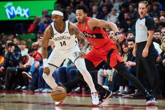 November 23, 2025, Toronto, On, Canada: Brooklyn Nets Terance Mann (14) drives past Toronto Raptors Scottie Barnes (4) during first half NBA, Basketball Herren, USA basketball action in Toronto, on Sunday, Nov. 23, 2025. Canada News - November 23, 2025 - ZUMAc35_ 20251123_zaf_c35_108 Copyright: xSammyxKoganx
